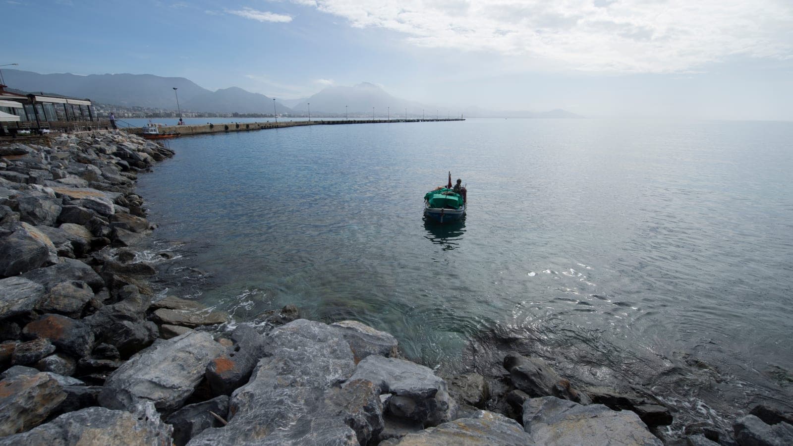 Boats moored along the harbour front at Alanya
