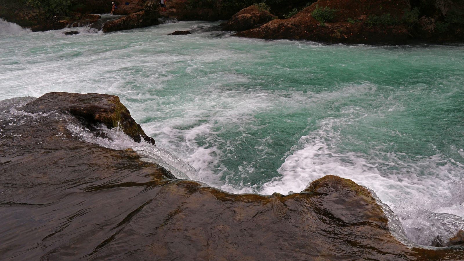 The wide curtain of Manavgat Waterfall on the river