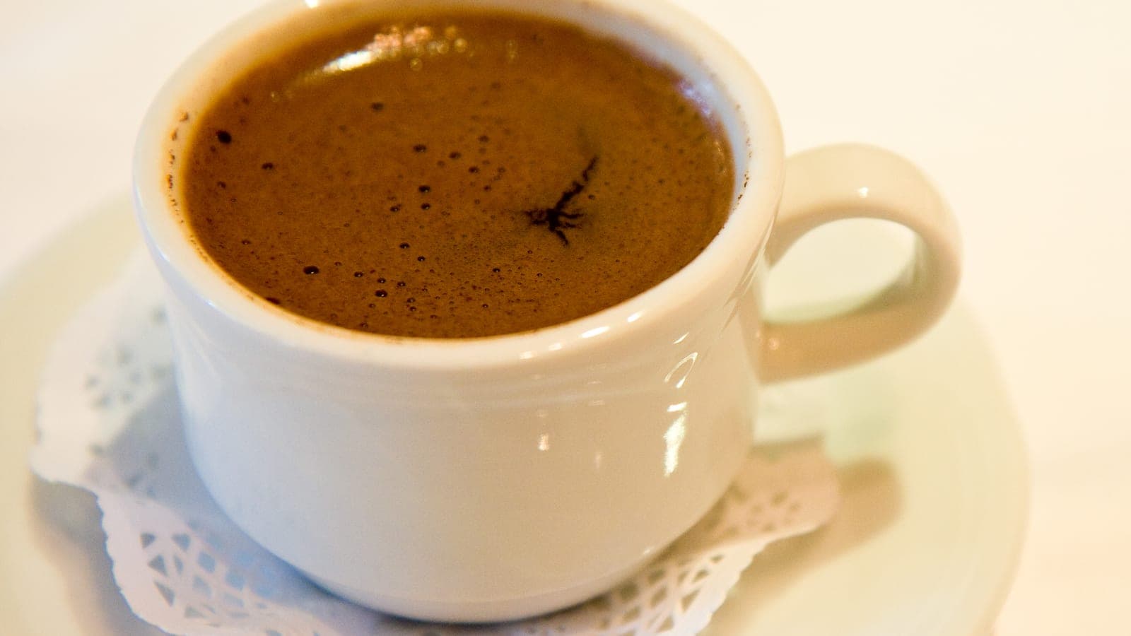 Small cup of Turkish coffee with thick crema