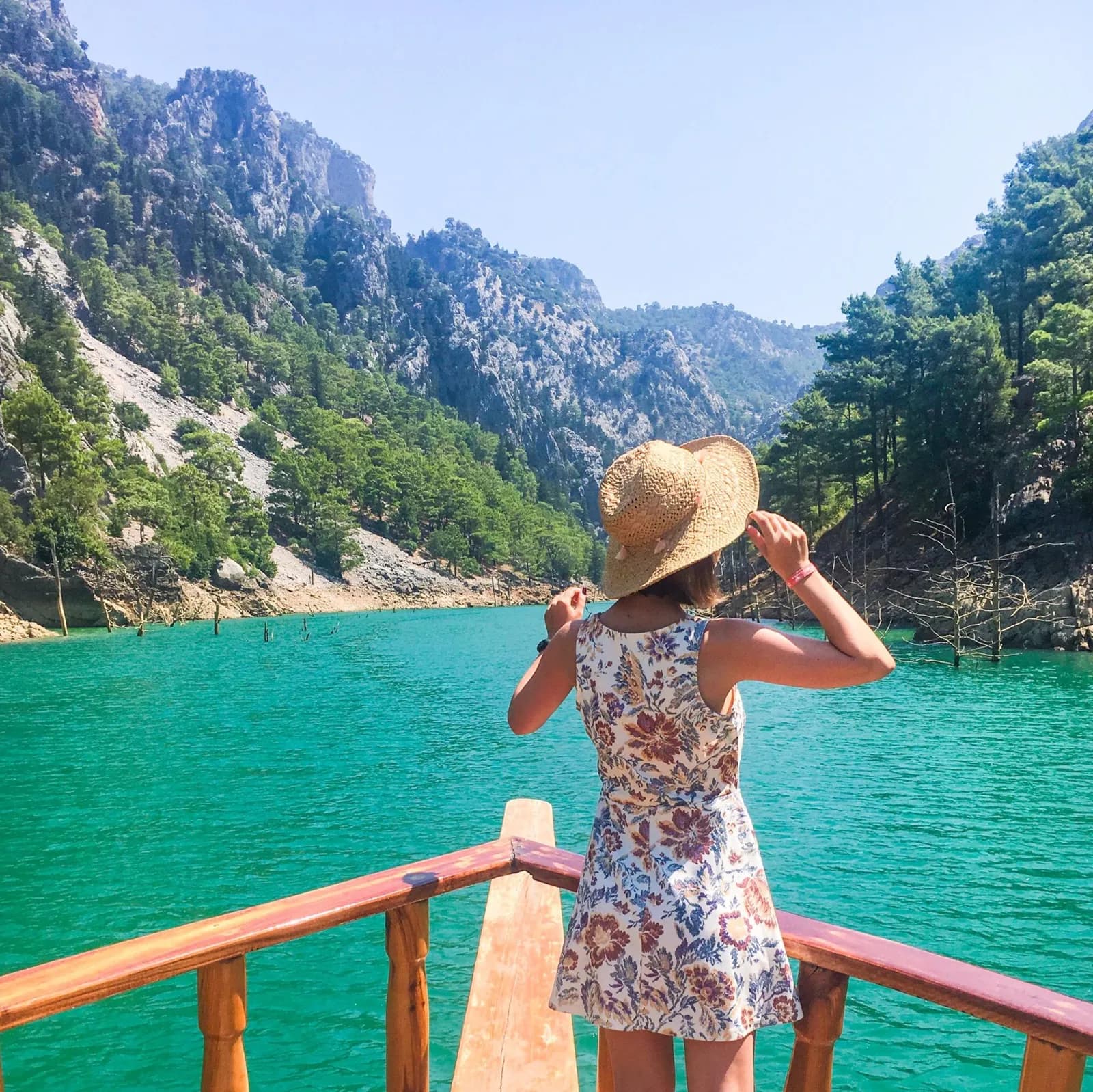 People swimming in the designated safe swimming area of Green Lake near the Taurus Mountains