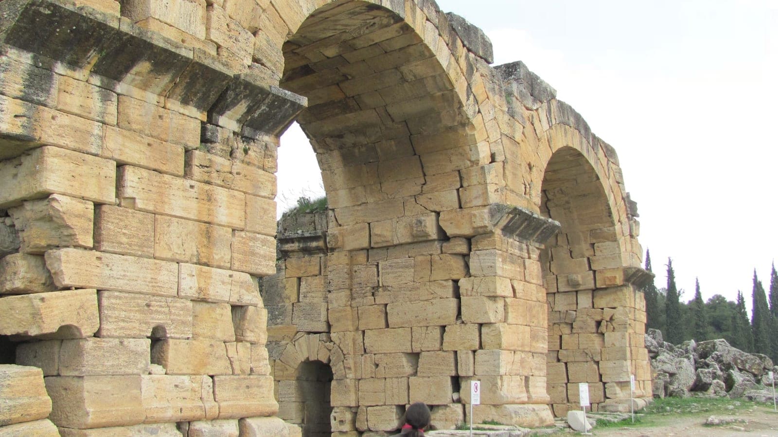Ancient stone ruins of Hierapolis above the Pamukkale terraces