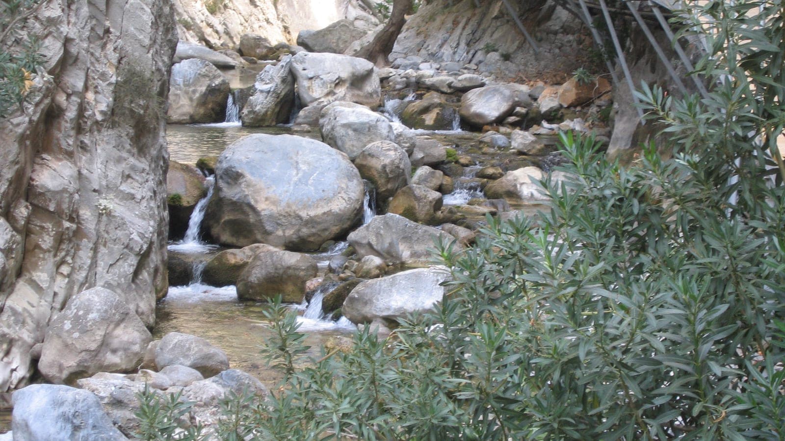 Wooden walkway running along the stream inside Sapadere Canyon