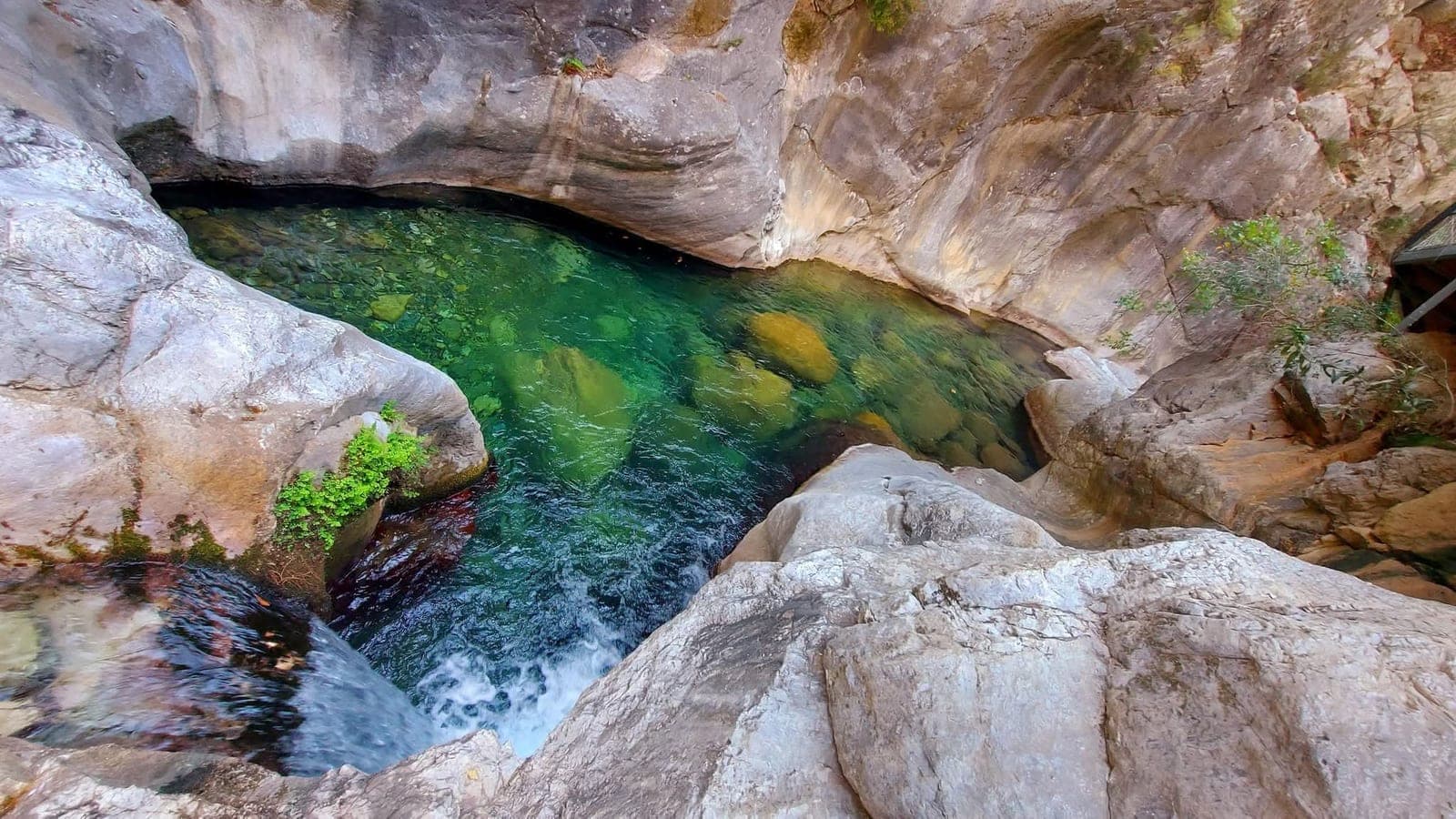 Waterfall and clear pool at the end of the Sapadere Canyon walkway