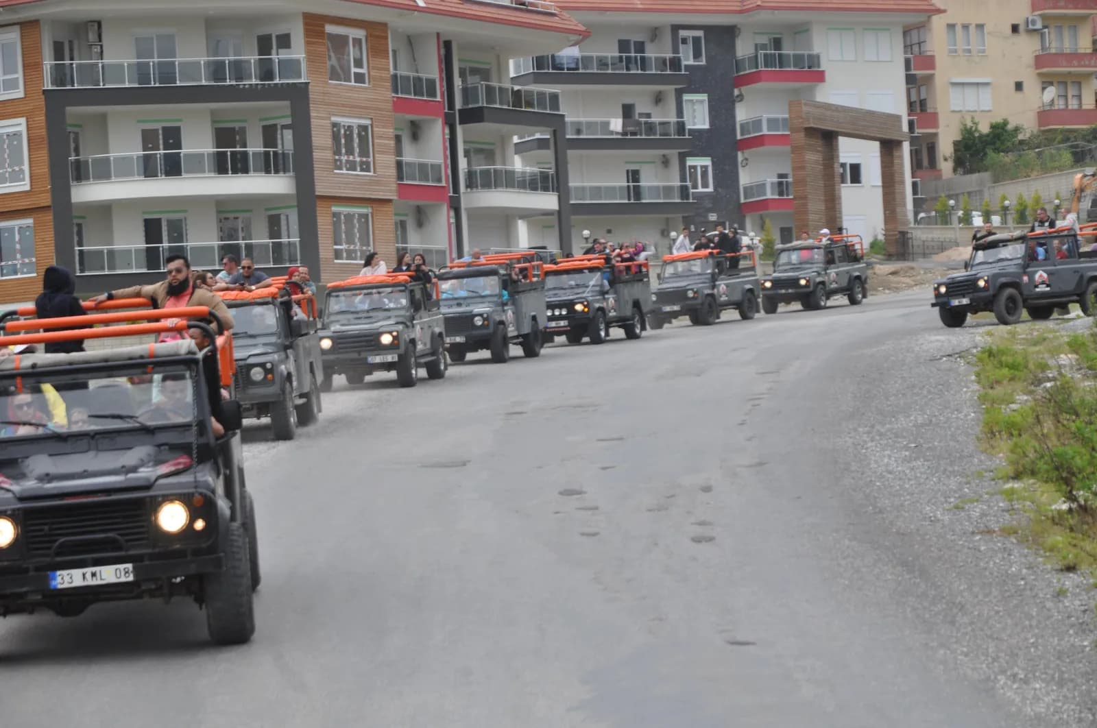 Tourists sitting in an open-top jeep during an off-road safari in Alanya